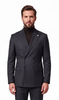 A man modeling a dark gray double-breasted pinstripe suit with a black turtleneck and black dress shoes, shot against a solid white background.